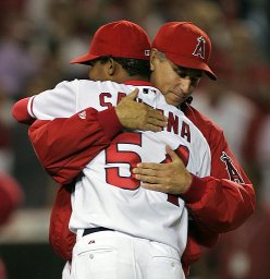 Ervin Santana hugs Buddy Black