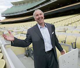 Frank McCourt with the newly renovated pastel seats in Dodger Stadium